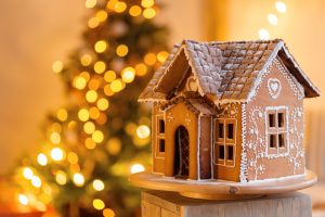 Holiday decorations, with lights on a Christmas tree in the background